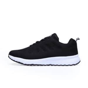 Zapatillas deportivas negras y blancas para mujer con cordones para correr y caminar.